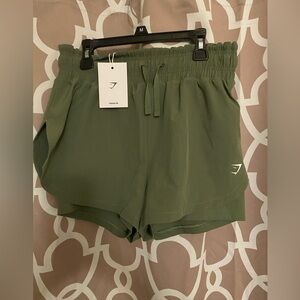 GYMSHARK NWT women’s  Forrest green shorts high waisted in size Medium.